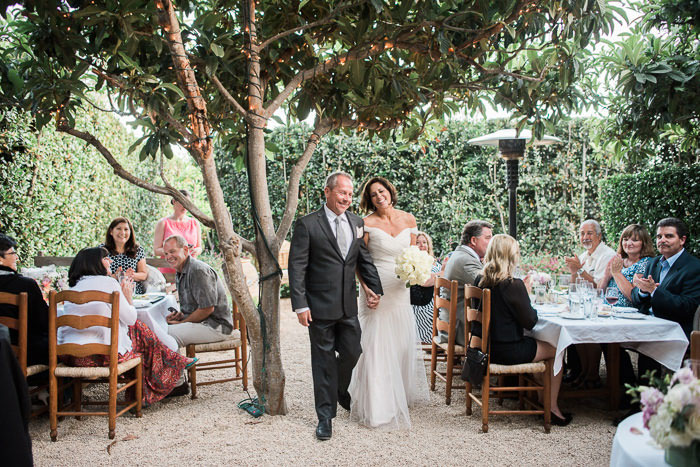 bride and groom making reception entrance