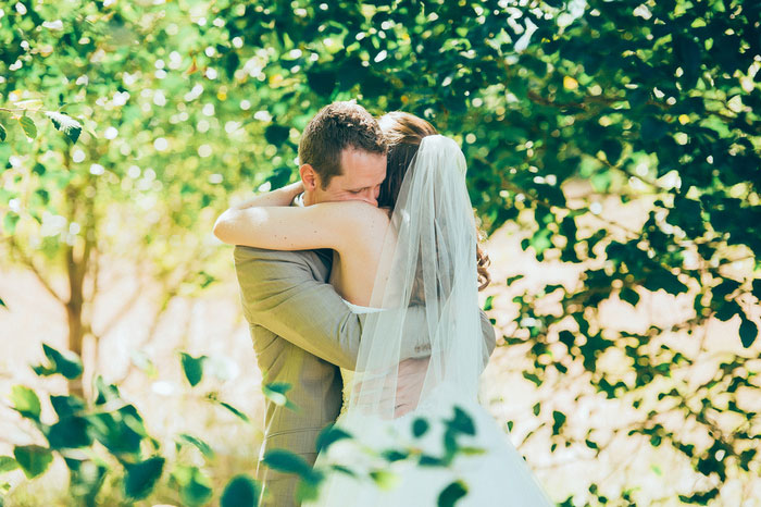 groom hugging bride seeing her for the first time