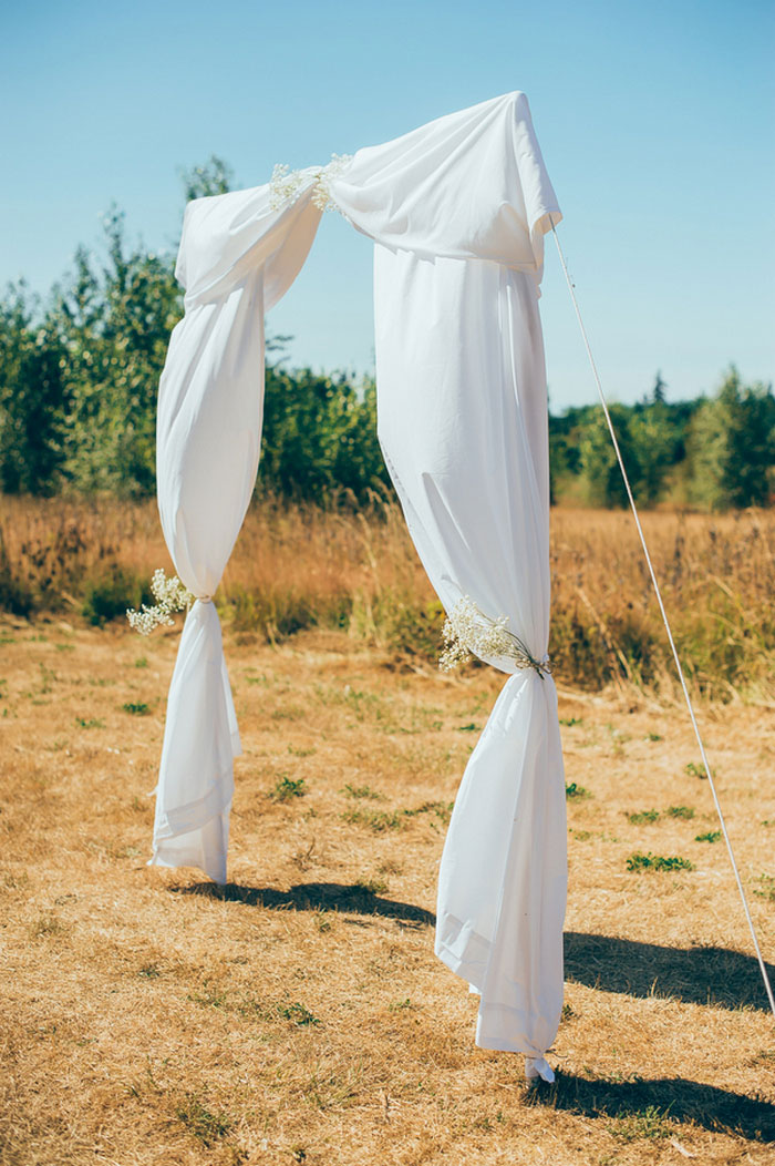 white fabric aisle entrance