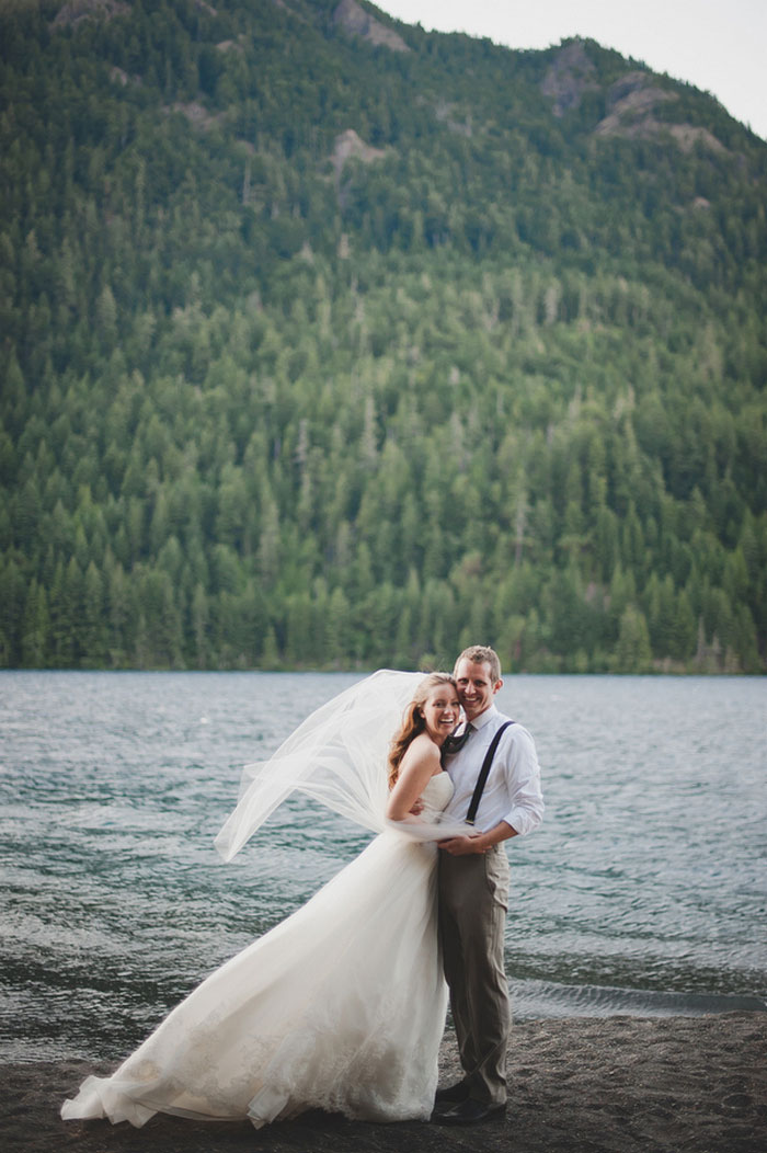 bride and groom by the lake