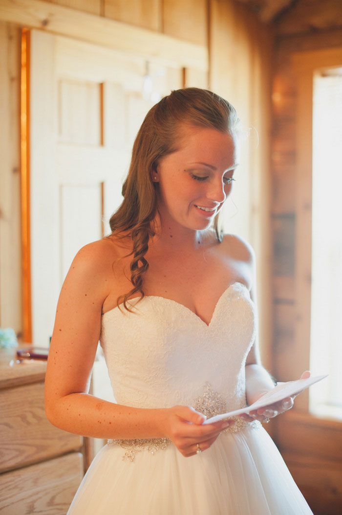 bride reading letter from her fiancé 