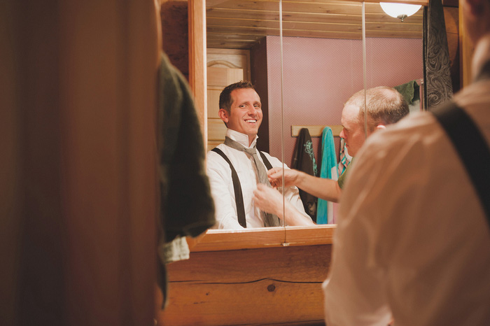 groom getting his tie tied