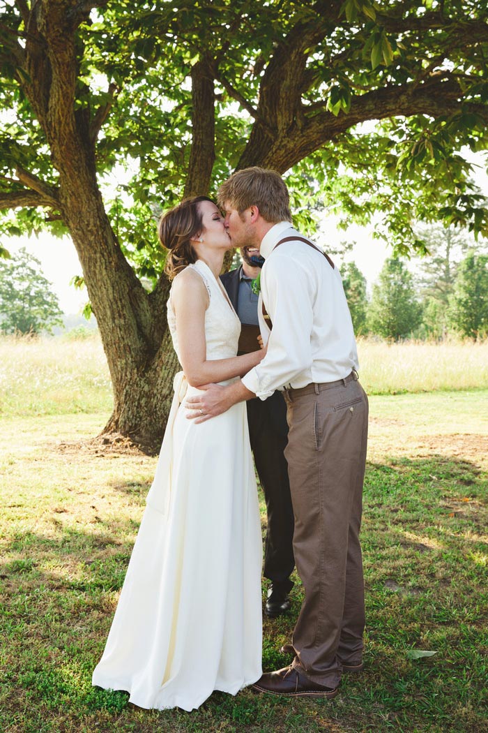 bride and groom first kiss