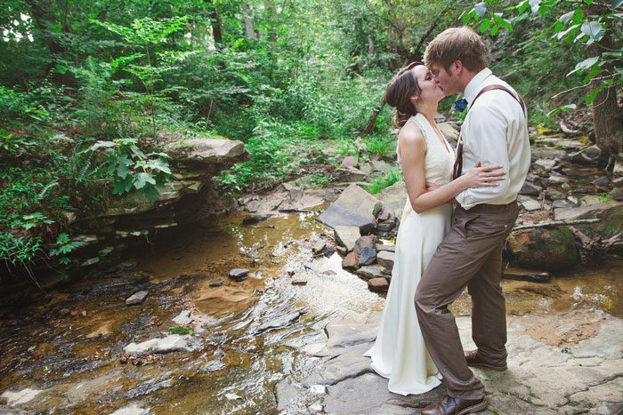 bride and groom portrait in creek