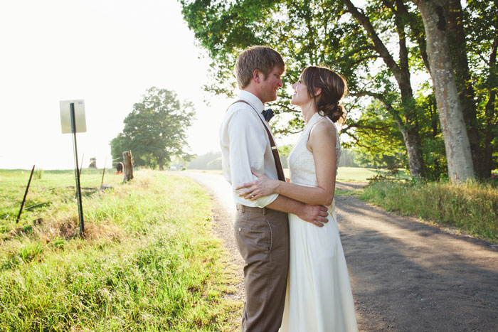 bride and groom portrait on country road
