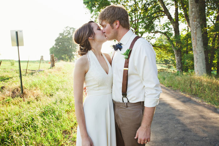 bride and groom portrait on country road