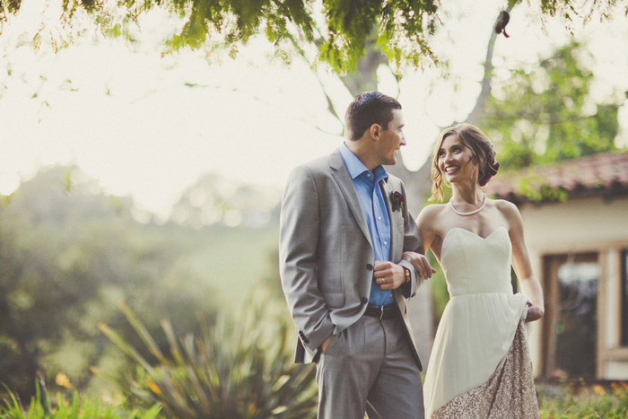 bride and groom walking arm in arm