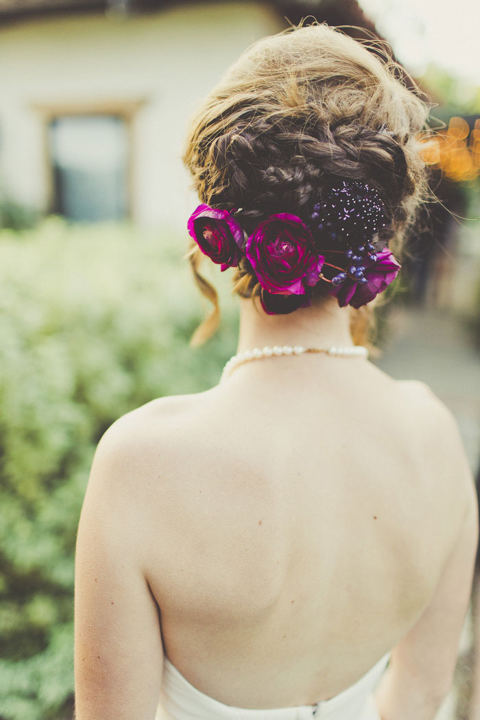 purple flowers in bride's hair