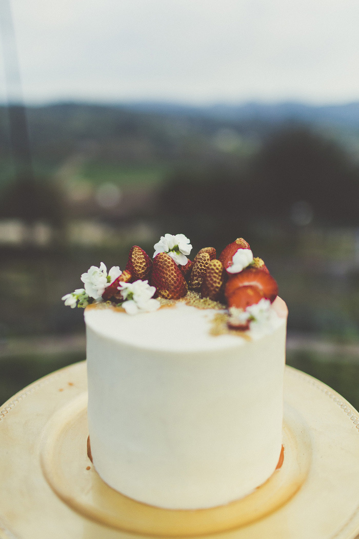 wedding cake with strawberries on top