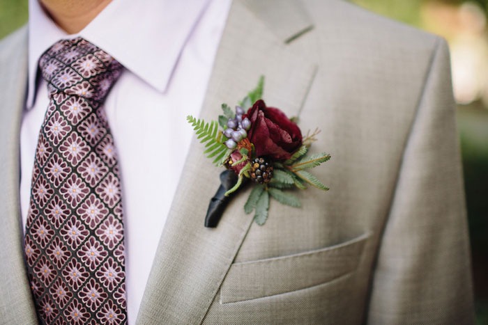 boutonniere pinned to groom's jacket