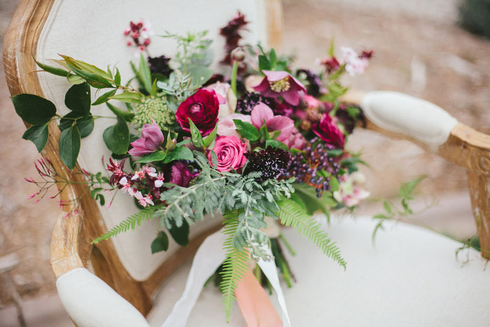 lush wedding bouquet on antique chair