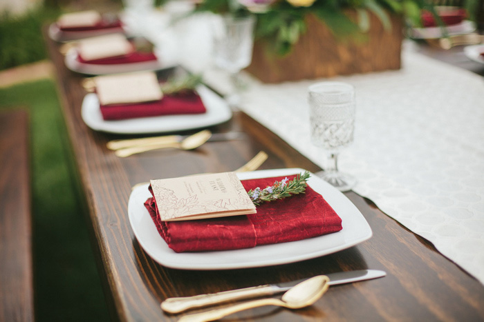 wedding place setting with red napkin