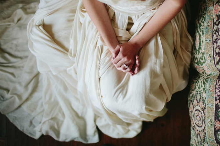 bride's hands folded in her lap