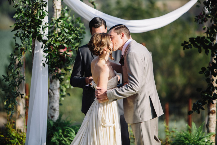 bride and groom first kiss