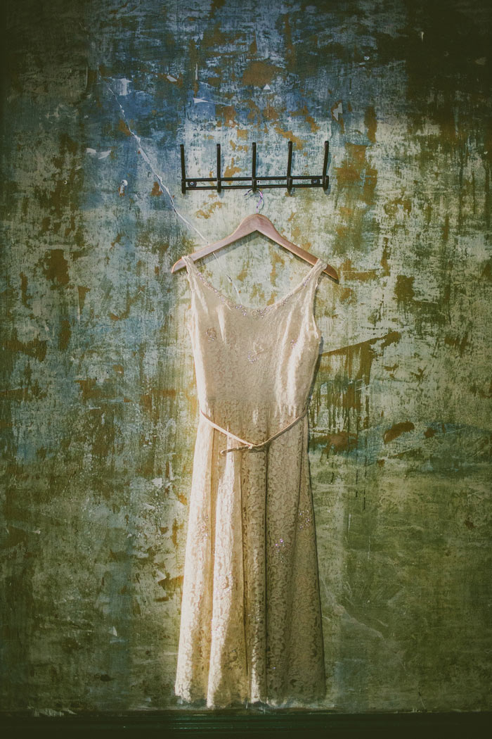 wedding dress hanging on wall