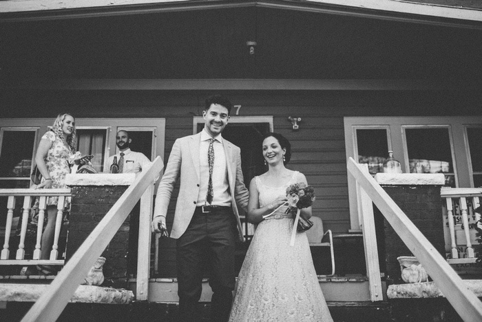 bride and groom walking down steps