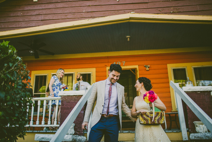 bride and groom walking down steps