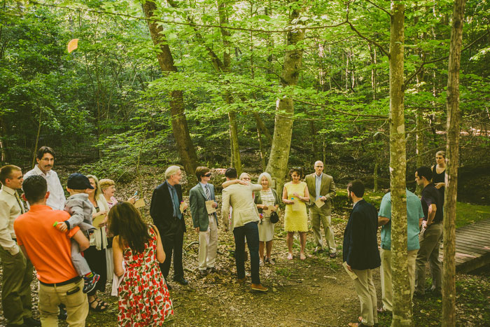 groom hugging guests at ceremony