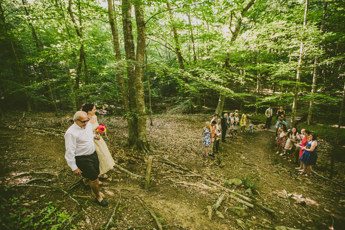 bride walking towards aisle with father