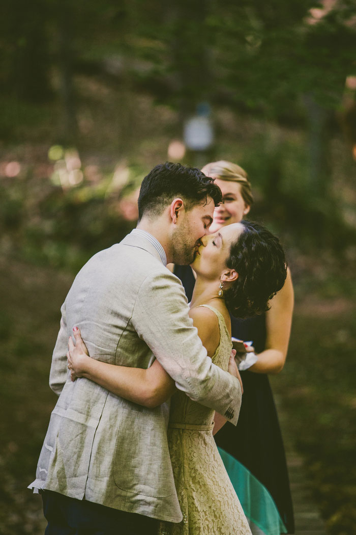 bride and groom first kiss