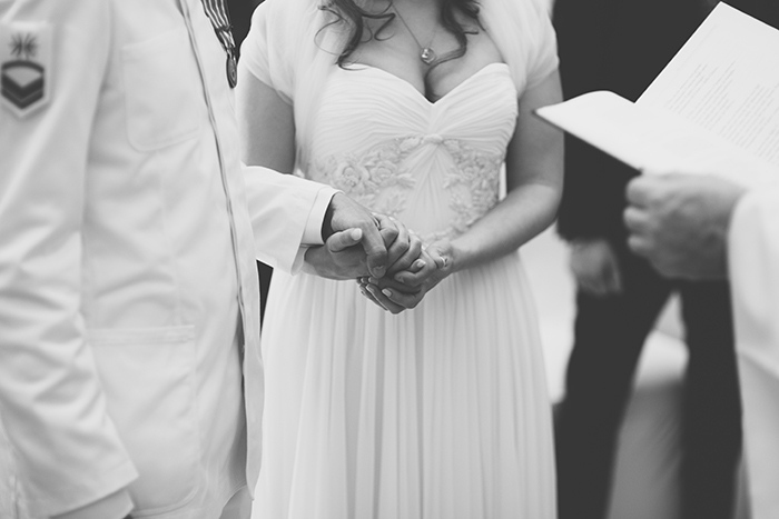 bride and groom holding hands during ceremony
