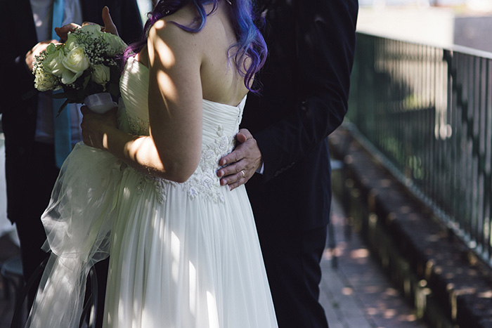 groom's hand on bride's back