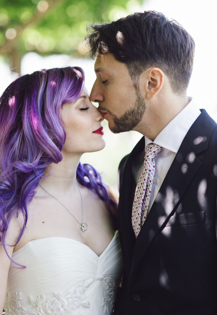 groom kissing bride's nose