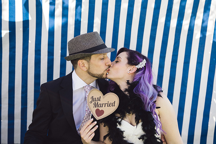 bride and groom with just married sign