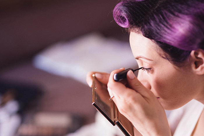 bride putting on mascara