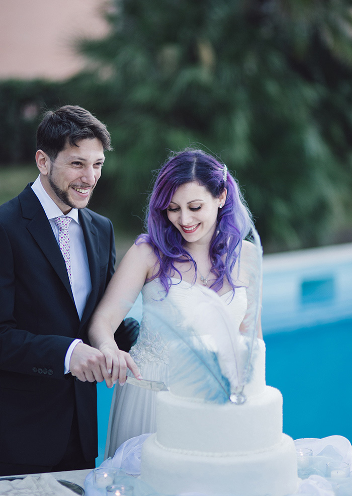 bride and groom cutting cake