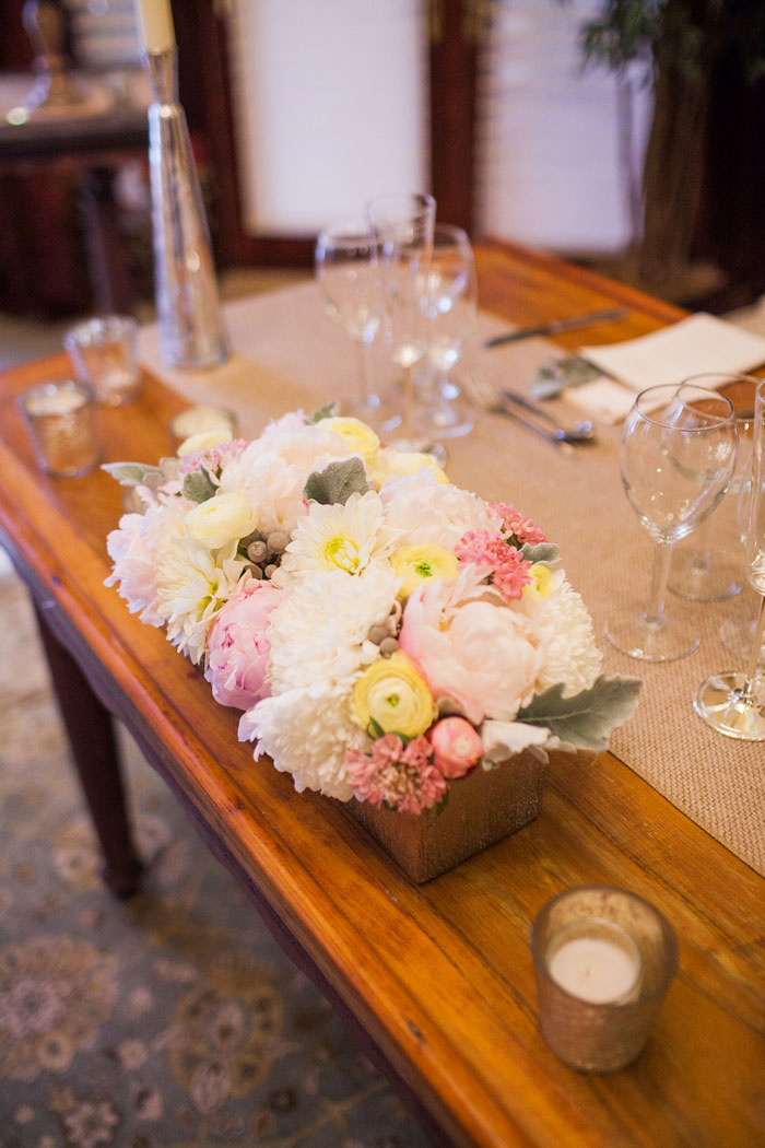 rose and ranunculus wedding centerpiece