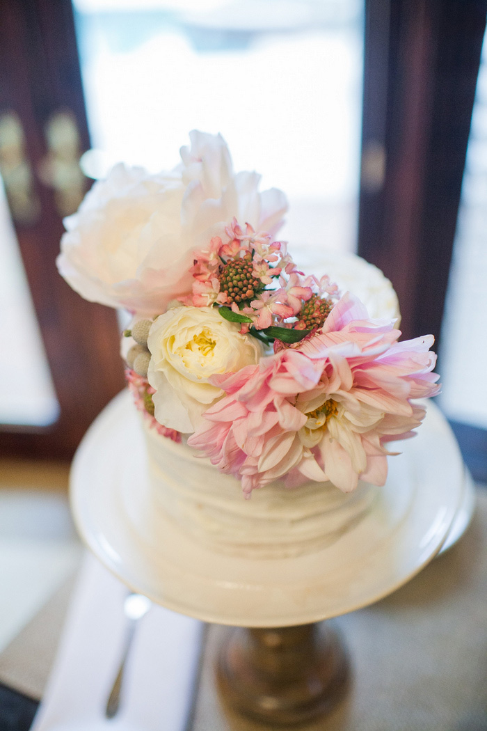 fresh flower covered wedding cake