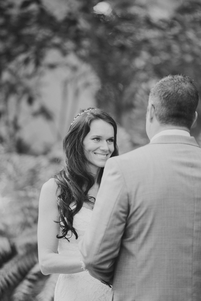 bride smiling at groom during ceremony