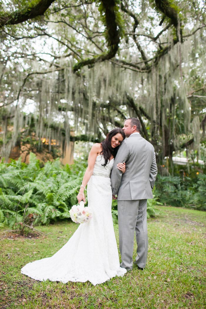 bride resting head on groom's shoulder