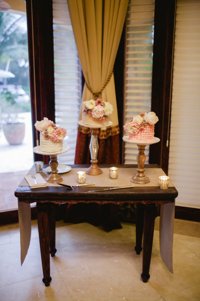 table with 3 small wedding cakes