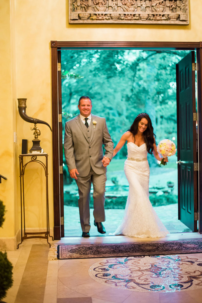 bride and groom making reception entrance