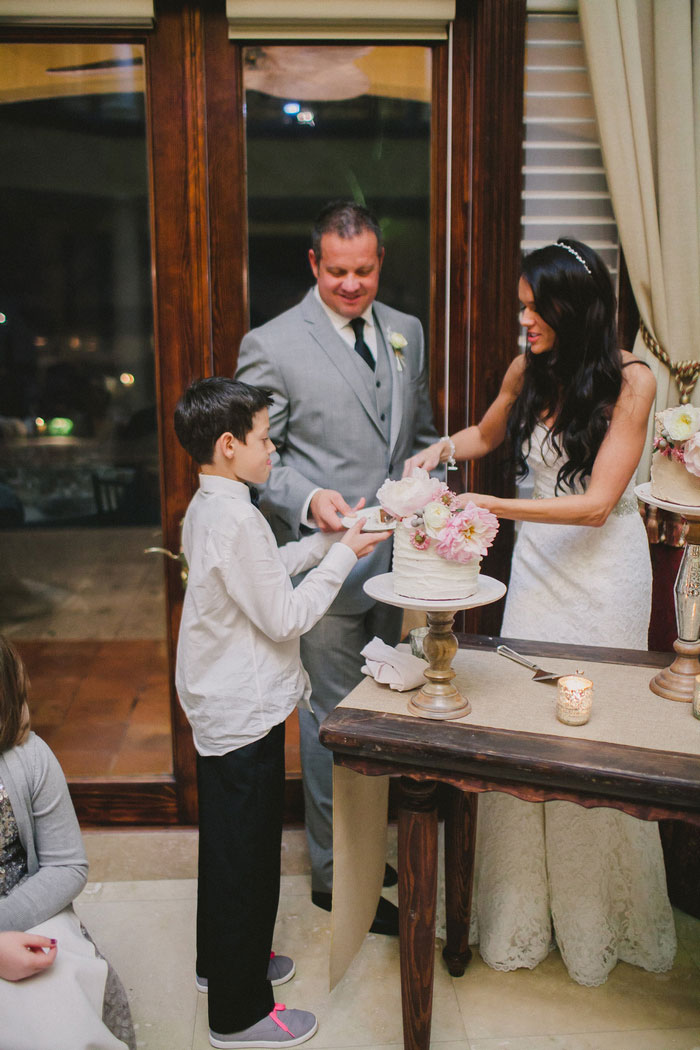 bride and groom cutting the cake