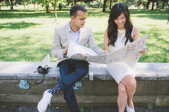 bride and groom reading map