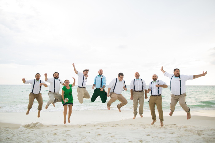 groomsmen portrait jumping on the beach