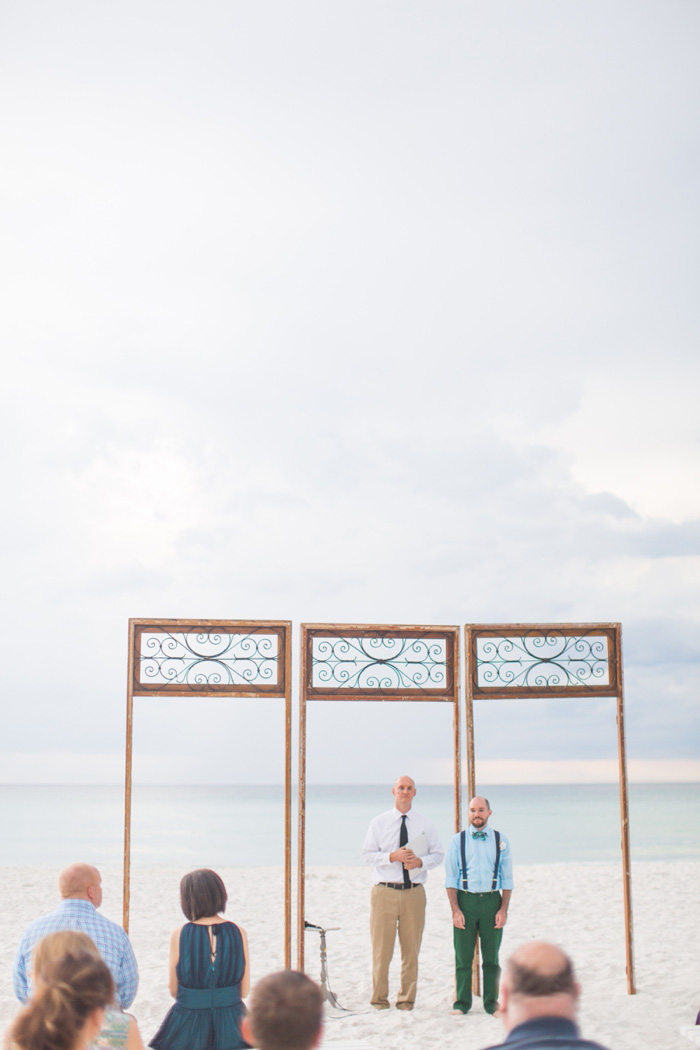 groom waiting at the altar on the beach