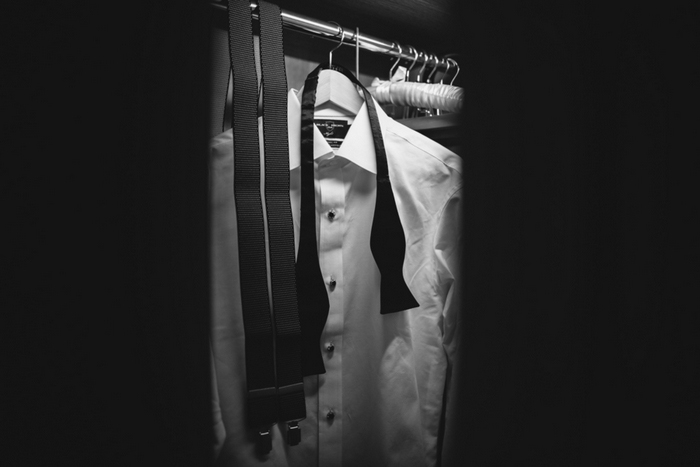 groom's tuxedo hanging in closet