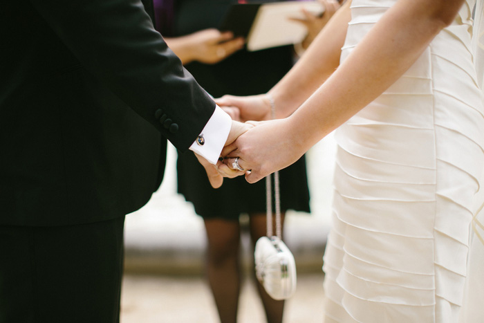 bride and groom holding hands during elopement ceremony