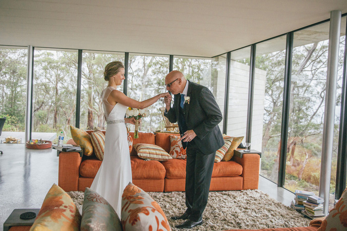 father of the bride kissing daughter's hand