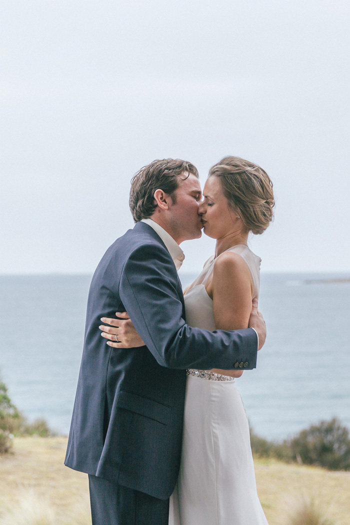 bride and groom first kiss