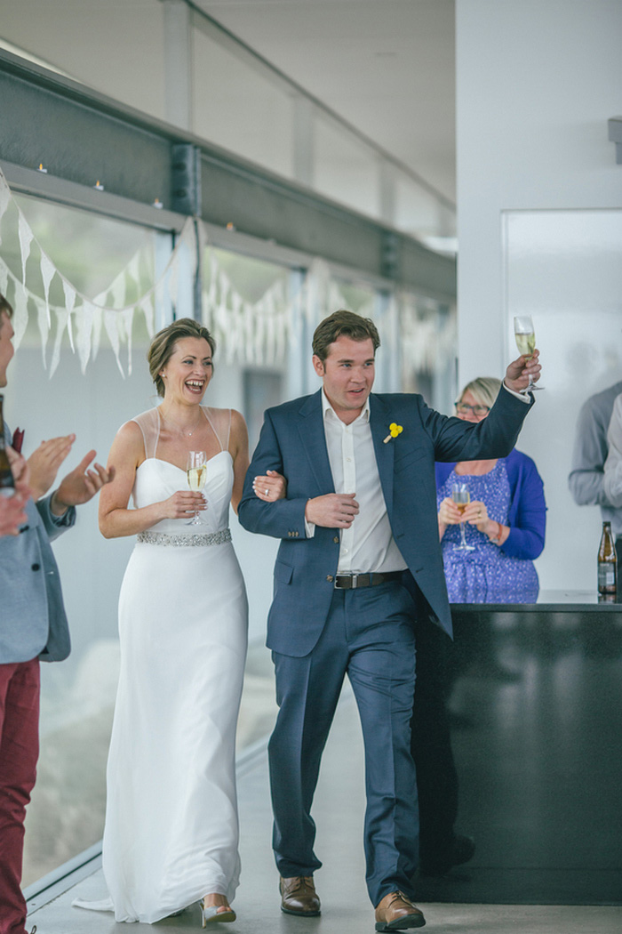 bride and groom making reception entrance