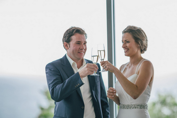 bride and groom toasting with champagne 