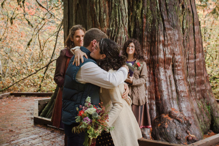 bride hugging son during elopement ceremony