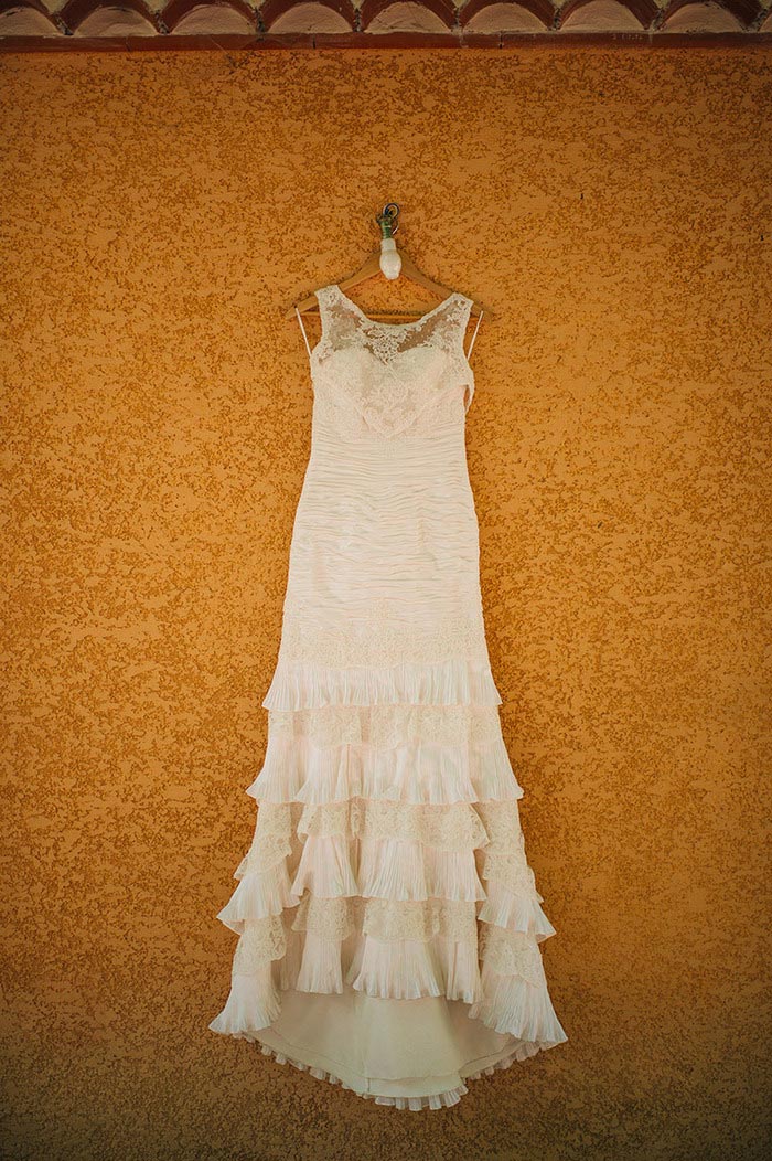 wedding dress hanging on wall