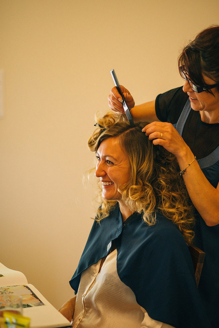 bride having her hair done