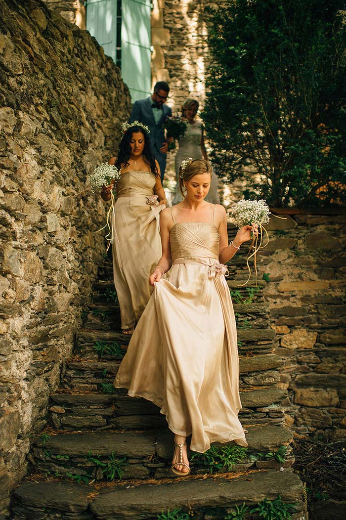 bridesmaids walking down stone steps